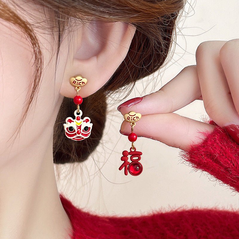 Cat Shop Boys - A Pair of Elegant And Festive New Year Oil Drop Ingot Earrings Featuring a Lion And The Character for Fortune in a Modern Chinese Style.